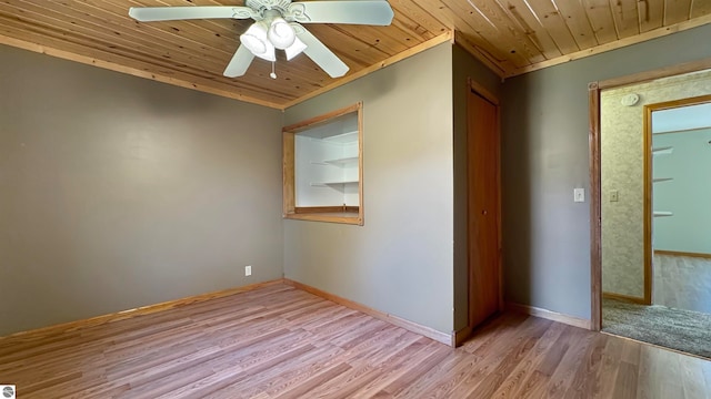 unfurnished room with ornamental molding, wooden ceiling, light wood-type flooring, and ceiling fan