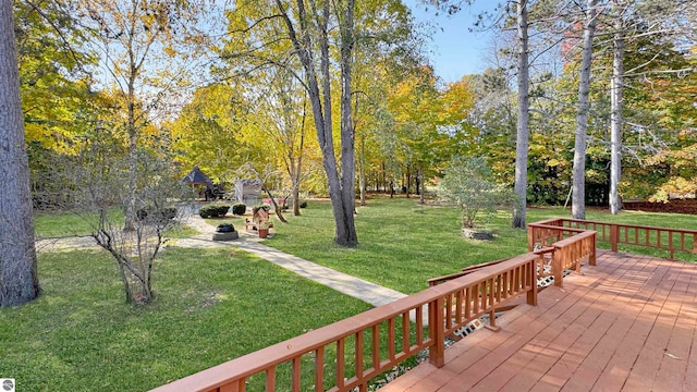 wooden terrace with a lawn