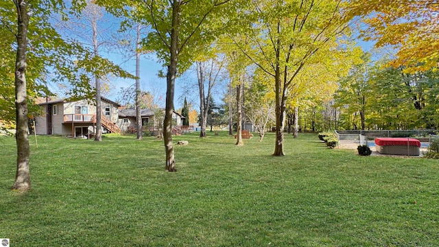 view of yard featuring a wooden deck