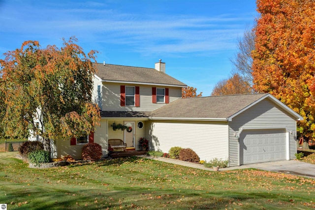 front of property featuring a front lawn and a garage