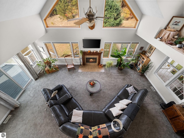 living room featuring carpet, high vaulted ceiling, and ceiling fan