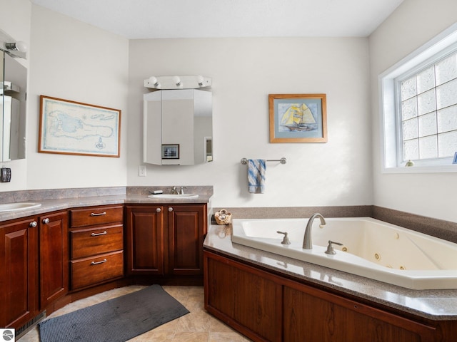 bathroom featuring vanity and a bath