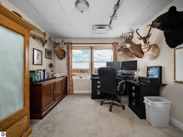 home office featuring a paneled ceiling, light colored carpet, and track lighting