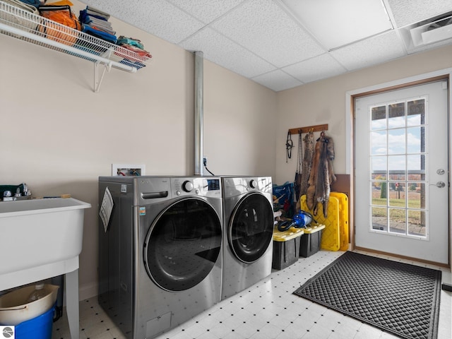 laundry area featuring independent washer and dryer and a wealth of natural light