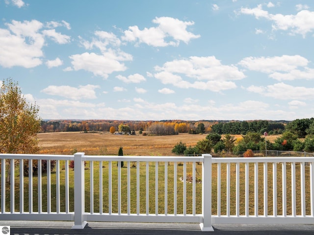 exterior space featuring a yard and a rural view