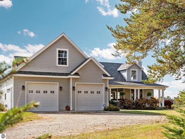 view of front of house featuring covered porch and a garage