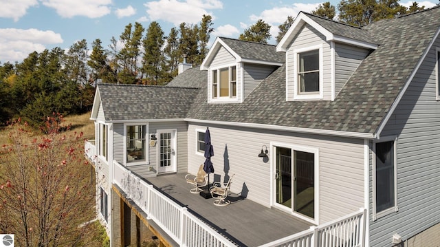 rear view of house with a wooden deck