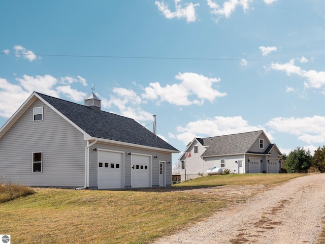 view of side of property with a yard