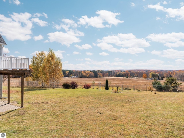 view of yard featuring a deck and a rural view