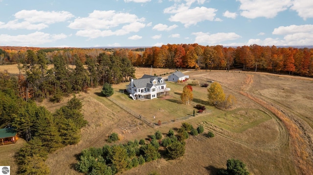 birds eye view of property with a rural view