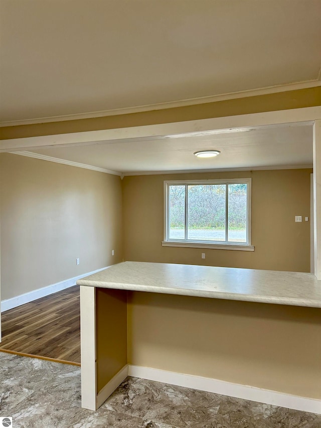 interior space with ornamental molding and hardwood / wood-style floors