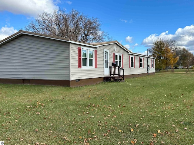 exterior space with crawl space and a front lawn