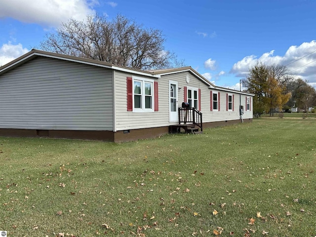 exterior space with crawl space and a front lawn