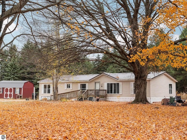 view of front of home with a shed