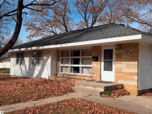 single story home featuring covered porch