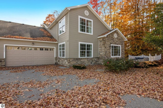 view of side of property featuring a garage