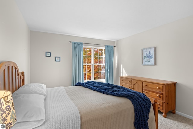 bedroom featuring light colored carpet