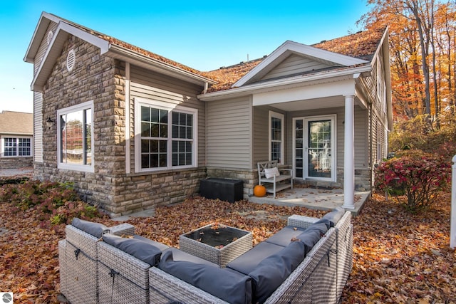 back of property featuring an outdoor hangout area