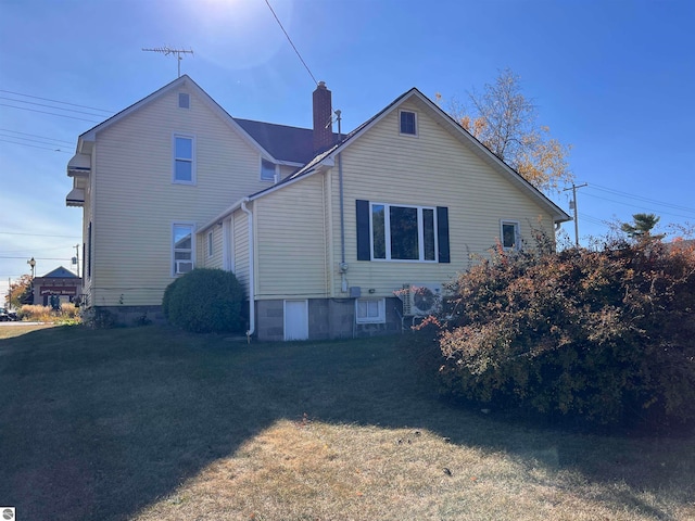 view of home's exterior featuring a yard