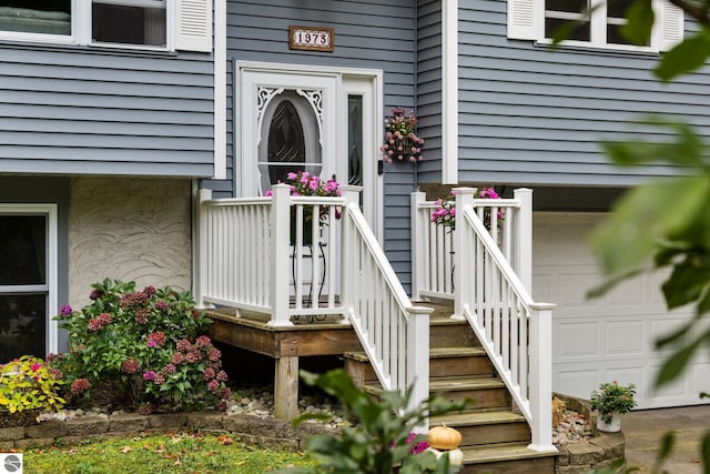 view of exterior entry featuring a garage