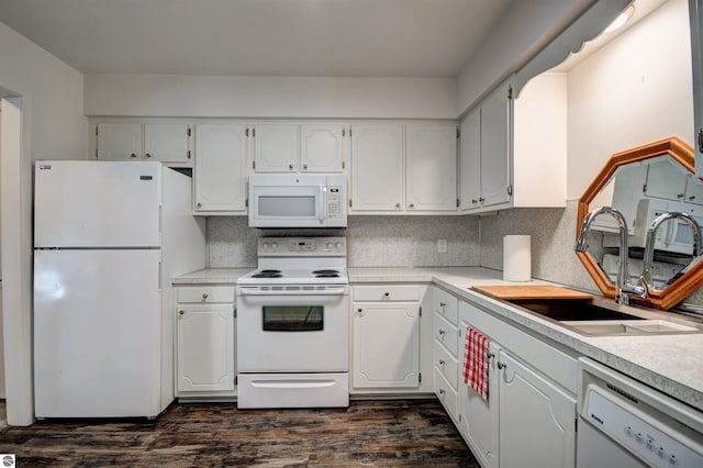 kitchen featuring sink, dark wood-type flooring, white cabinets, and white appliances