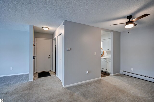 interior space featuring a baseboard radiator, a textured ceiling, and ceiling fan