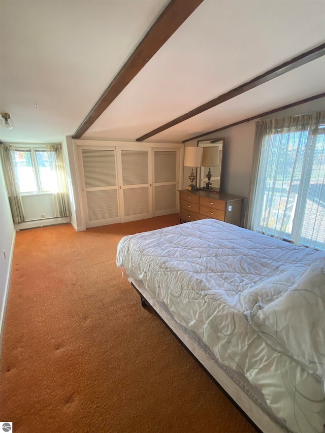 carpeted bedroom featuring beamed ceiling and a baseboard heating unit