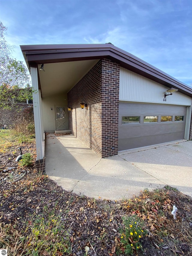 view of side of property with a garage