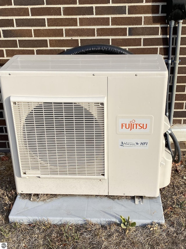 616 Holiday Dr, Bellaire, MI 49615 - exterior view of ac unit