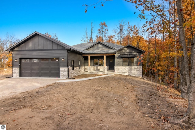 view of front of house featuring covered porch and a garage