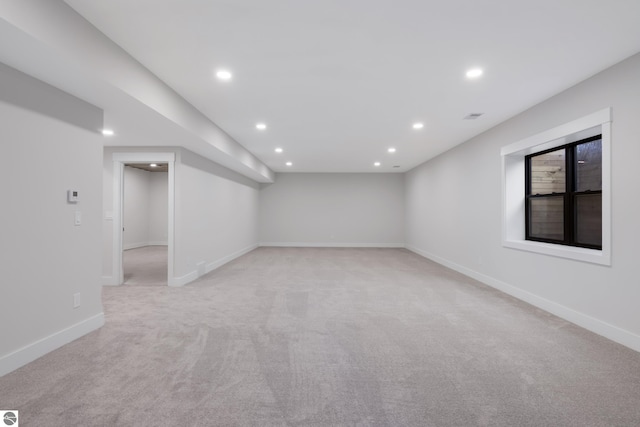 spare room with light colored carpet