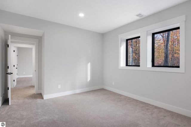 empty room featuring light colored carpet