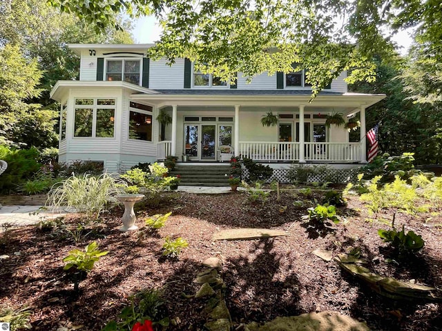 back of house featuring a porch