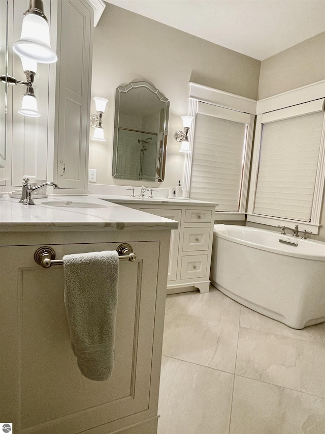 11320 Shippey Ln, Rapid City, MI 49676 - full bath featuring double vanity, a sink, marble finish floor, and a bathing tub