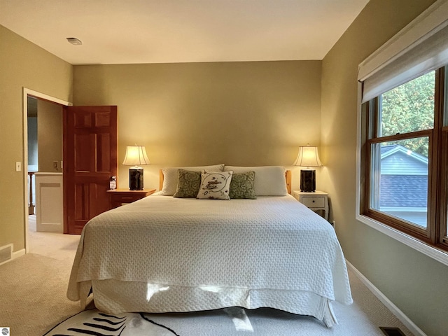11320 Shippey Ln, Rapid City, MI 49676 - bedroom featuring baseboards and light colored carpet