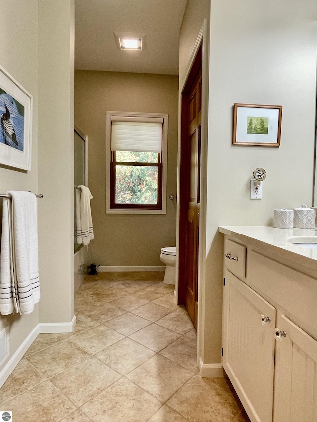 11320 Shippey Ln, Rapid City, MI 49676 - full bathroom with an enclosed shower, tile patterned flooring, vanity, baseboards, and toilet
