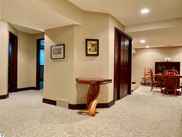 hallway featuring carpet flooring