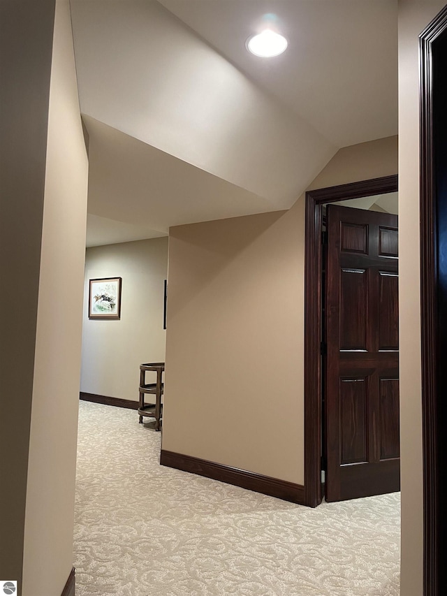 11320 Shippey Ln, Rapid City, MI 49676 - hall with carpet floors, baseboards, and lofted ceiling
