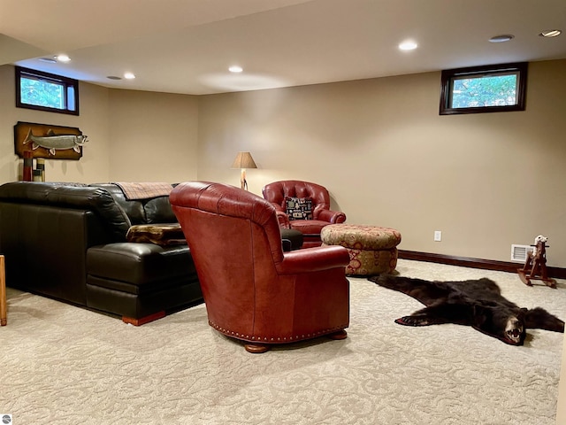 11320 Shippey Ln, Rapid City, MI 49676 - carpeted living room featuring recessed lighting, visible vents, and a wealth of natural light