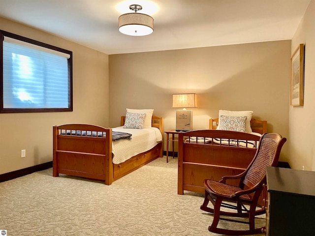 bedroom featuring light carpet