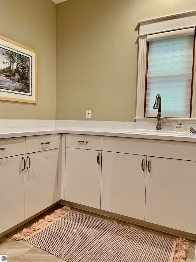 bathroom featuring vanity and hardwood / wood-style flooring