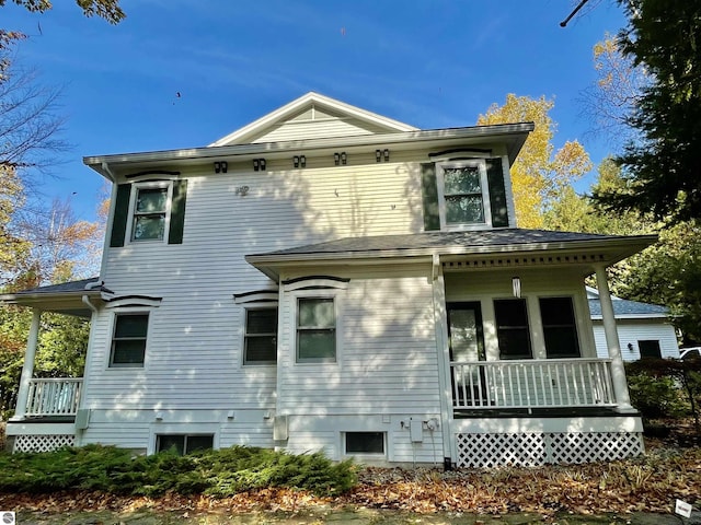 11320 Shippey Ln, Rapid City, MI 49676 - back of house with covered porch
