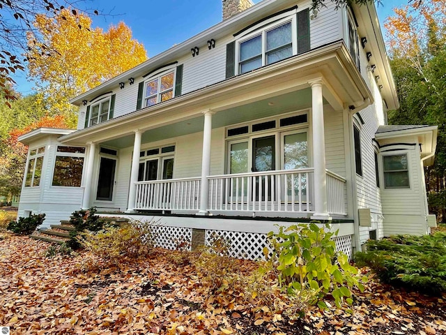 country-style home with a porch