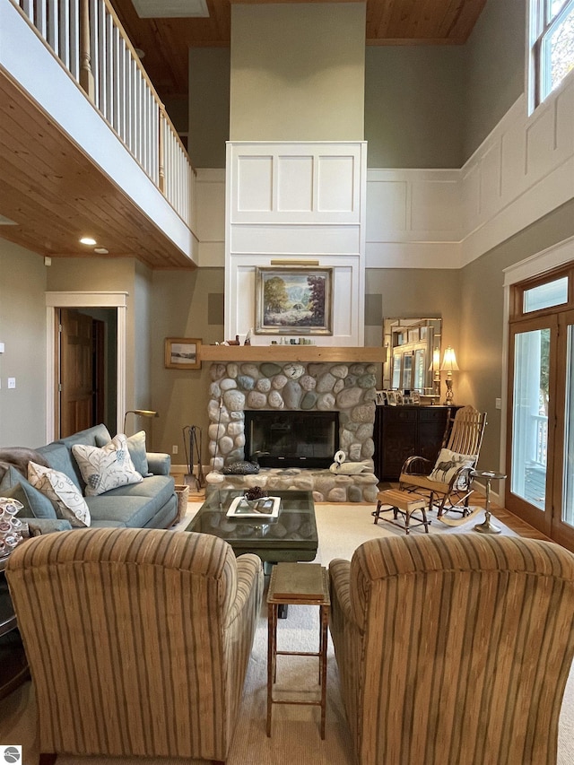 11320 Shippey Ln, Rapid City, MI 49676 - living room featuring a towering ceiling and a fireplace