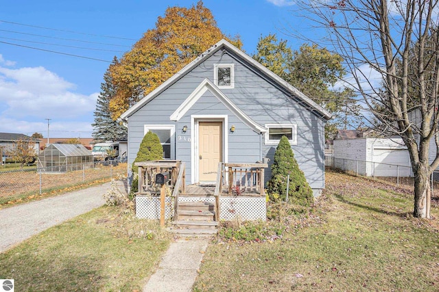 bungalow-style house with a front lawn