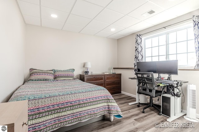 bedroom with hardwood / wood-style flooring