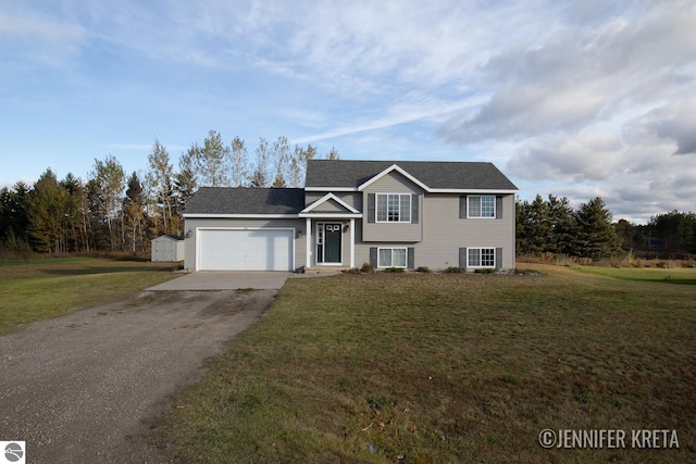 view of front facade featuring a front yard and a garage