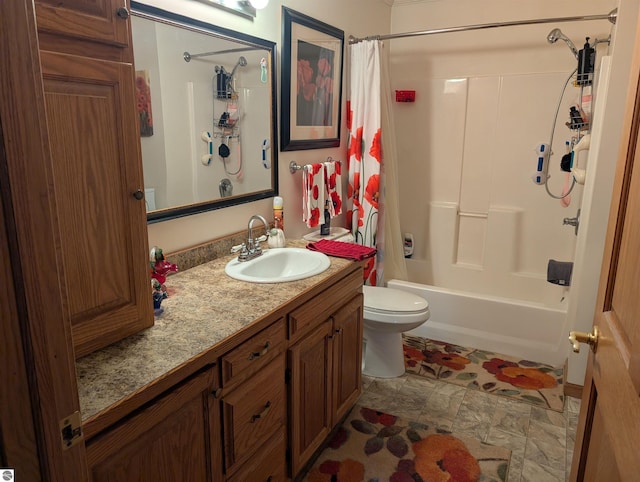 full bathroom with vanity, shower / bath combo, and toilet