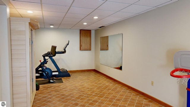 workout area with a drop ceiling