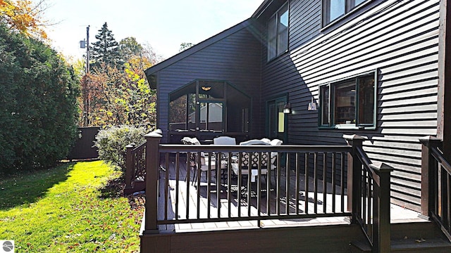 deck with outdoor lounge area and a lawn